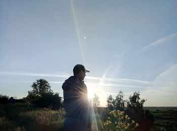 Man on field against sky