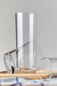 Close-up of wine glass on table against wall