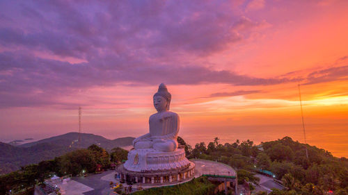 Statue against sky during sunset