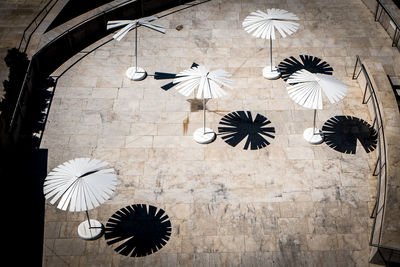 High angle view of parasols at park on sunny day