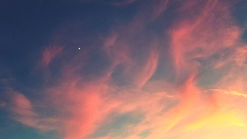 Low angle view of dramatic sky during sunset