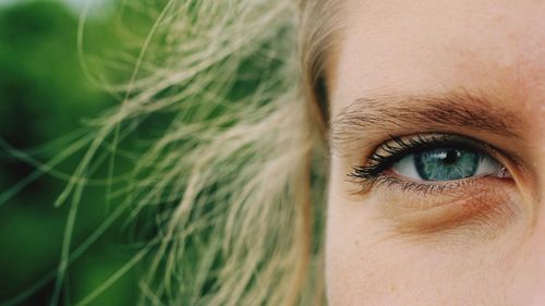 Close-up portrait of woman gray eye