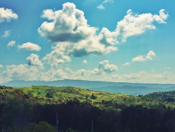 Scenic view of landscape against cloudy sky