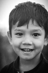 Close-up portrait of smiling boy