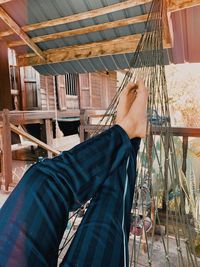 Low section of man working on wooden floor