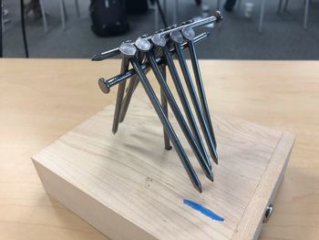 High angle view of metallic structure on table