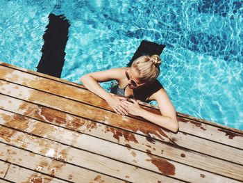 High angle view of woman standing in swimming pool