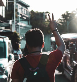 Rear view of man standing in city