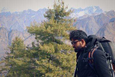 Man in mountains against sky