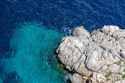 Bay on the peninsula la victoria, mallorca with rock in the water and rocky coastline
