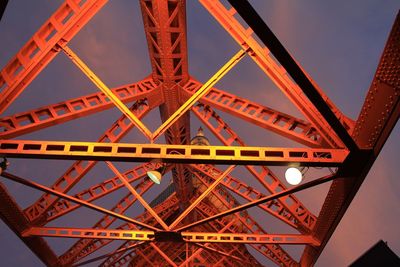 Architectural feature of illuminated tokyo tower against sky