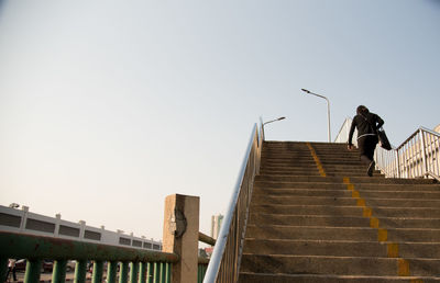 Low angle view of steps against clear sky