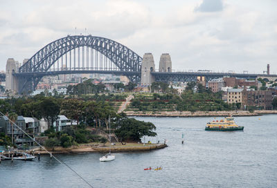 View of bridge over river against cloudy sky