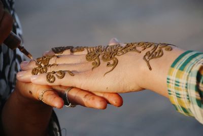 Close-up of hand holding hands