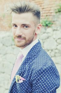 Portrait of young man standing outdoors