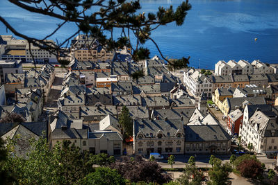 High angle view of townscape by sea