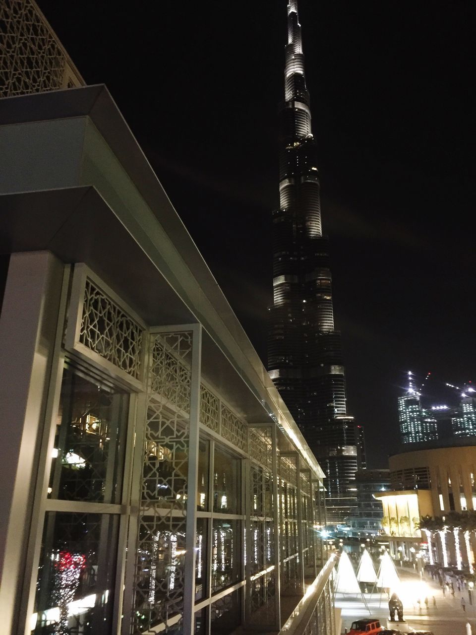 VIEW OF ILLUMINATED BUILDINGS AT NIGHT