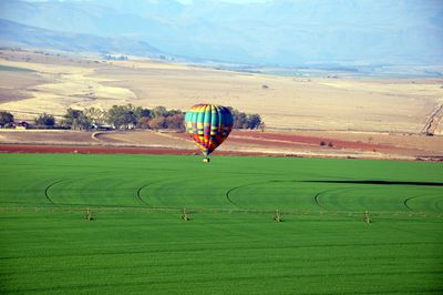 Hot air balloon over field