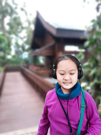 Cute girl standing outdoors