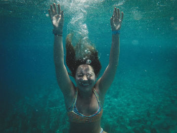 Woman swimming in sea