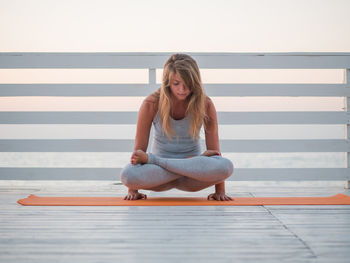 Young woman sitting outdoors