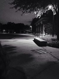 Empty road with houses in background