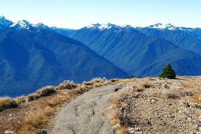 Scenic view of mountains against clear blue sky