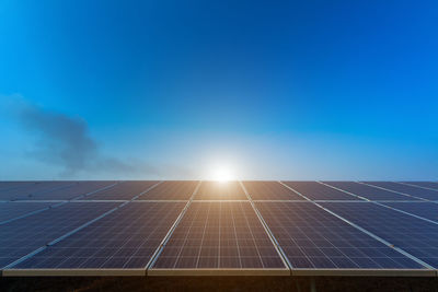 Low angle view of solar panels against sky