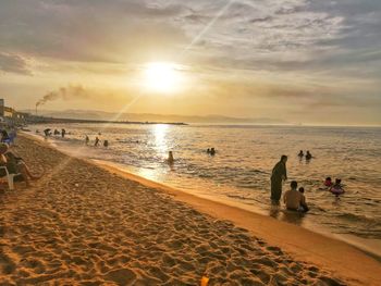 Scenic view of beach against sky during sunset