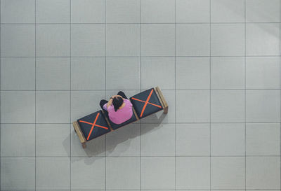 High angle view of people sitting on the floor
