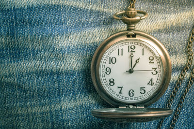 High angle view of clock on jeans