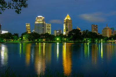 Scenic view of river and buildings against sky