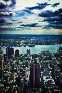 Cityscape against cloudy sky