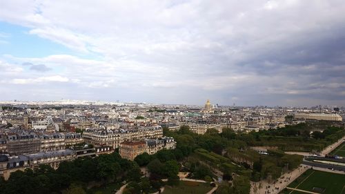 High angle view of cityscape against cloudy sky