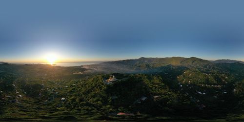 Scenic view of landscape against sky during sunset