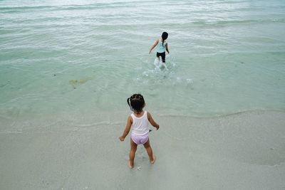 High angle view of children at the seaside