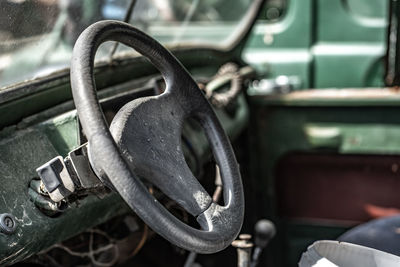 Close-up of rusty machine in car