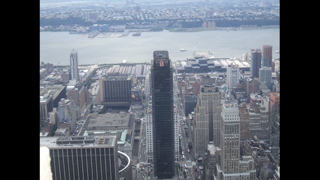 HIGH ANGLE VIEW OF CITY BUILDINGS AGAINST SKY