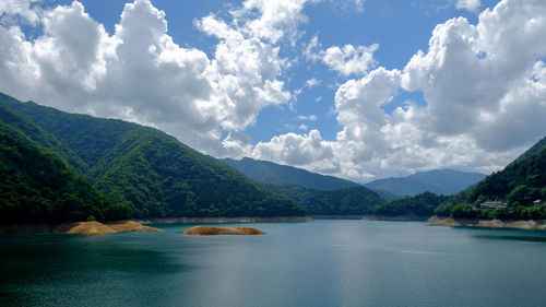 Okutama lake against mountains in summer
