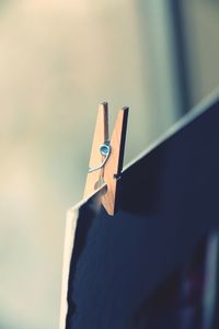 Close-up of clothespins on clothesline