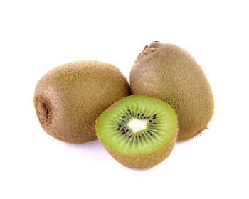 Close-up of fruits over white background