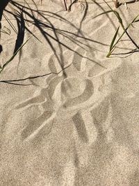 High angle view of shadow on sand