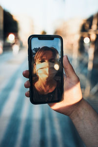 Man photographing with mobile phone