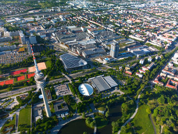 Flying around the munich olympia tower and the olympia stadium and also the bmw buildings