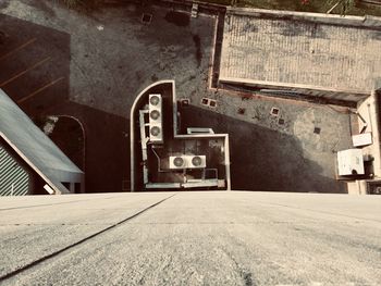 Rear view of man walking on road