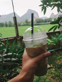 Close-up of hand holding drink