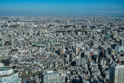 Aerial view of cityscape against sky