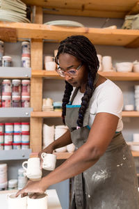 Side view of man working at workshop