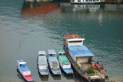 High angle view of fishing boats moored at lake