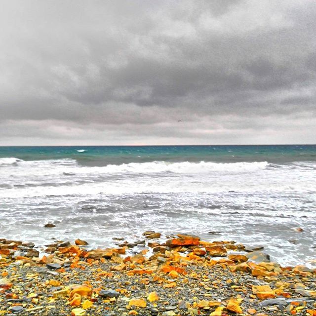 VIEW OF SEA AGAINST CLOUDY SKY